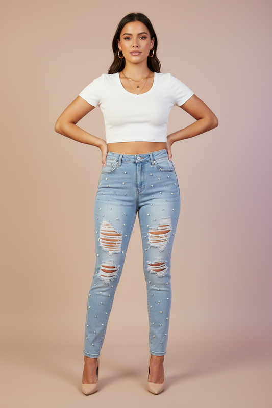 Model wearing light wash distressed pearl jeans matching reference